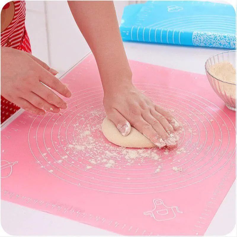 Silicone dough mat with measurements for spreading multi-colored pizza