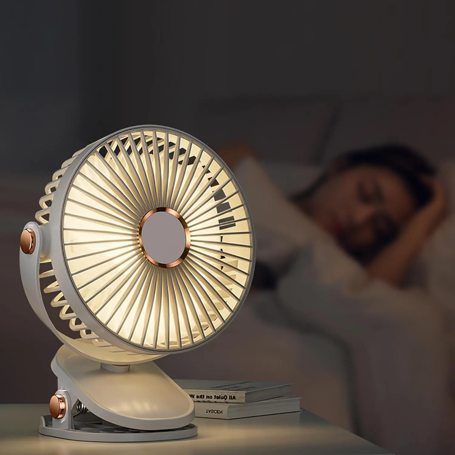 Small portable fan powered by USB charging, clip-on shape, equipped with a rotatable stand, colors